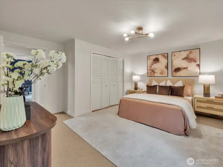 Serene primary bedroom with modern lighting and warm décor