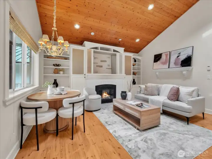 Cozy living area with wood ceiling and built-in fireplace