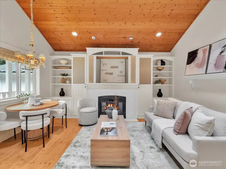 Light-filled cottage living space with fireplace and dining