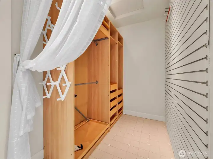 Spacious walk-in closet with custom built-in storage system