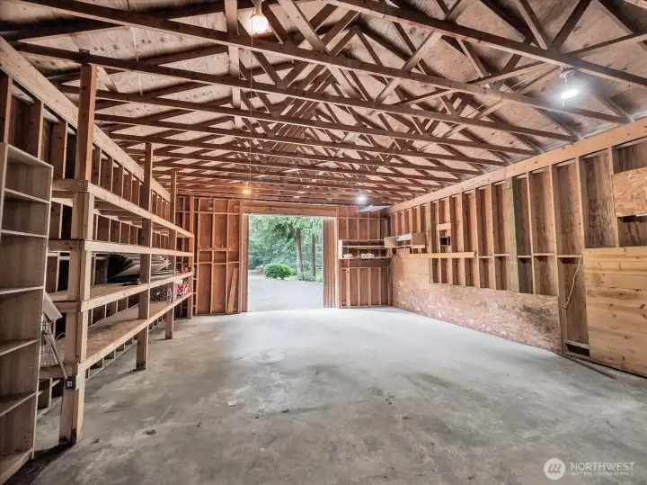 Spacious workshop/garage with shelving and storage