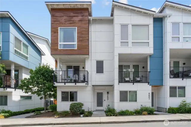 Welcome to this bright and private end-unit townhome!