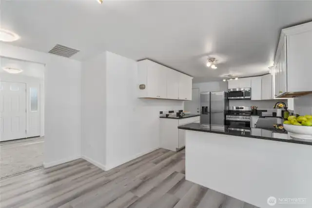 Elegant and spacious kitchen with large island bar and premium finishes