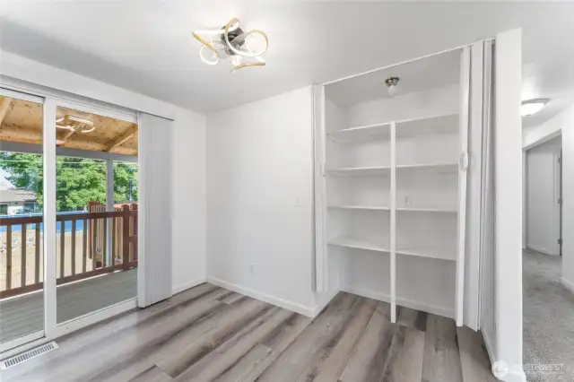 Direct access to an expansive rear deck for seamless indoor-outdoor living