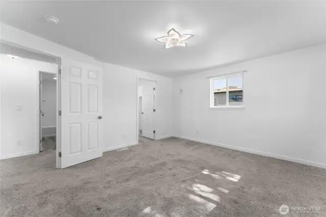 Main-level primary suite with generous space and private en-suite bath