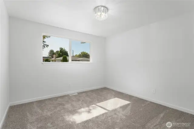 Second of three spacious bedrooms on the main level plus three additional bedrooms on the lower level for a total of five bedrooms!
