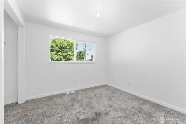 Main-level third bedroom plus there are also two additional bedrooms on the lower level for plenty of space