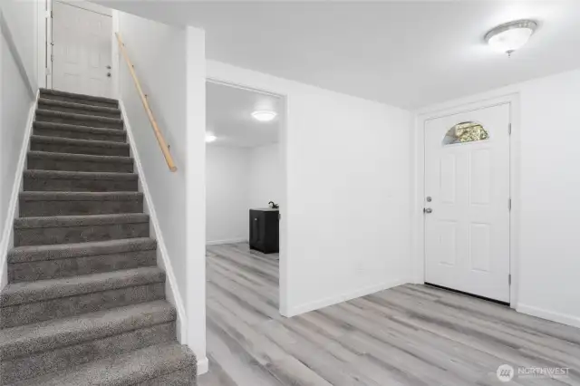 Heading downstairs, discover a second kitchen, two bedrooms, a huge family room, utility and storage spaces, a bathroom plus a separate entry on this level