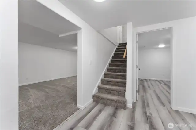 Spacious lower level with second kitchen, two bedrooms, a massive family room, utility and storage areas, a bathroom and separate entryway