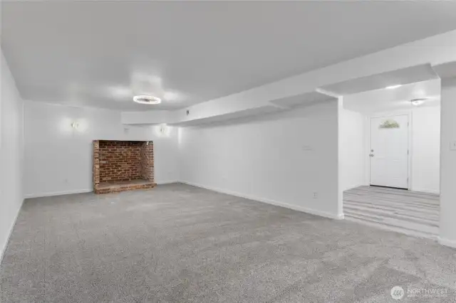 The perfect blend of comfort and income potential—separate-entry lower level with kitchen, two bedrooms, a bathroom and this massive family room