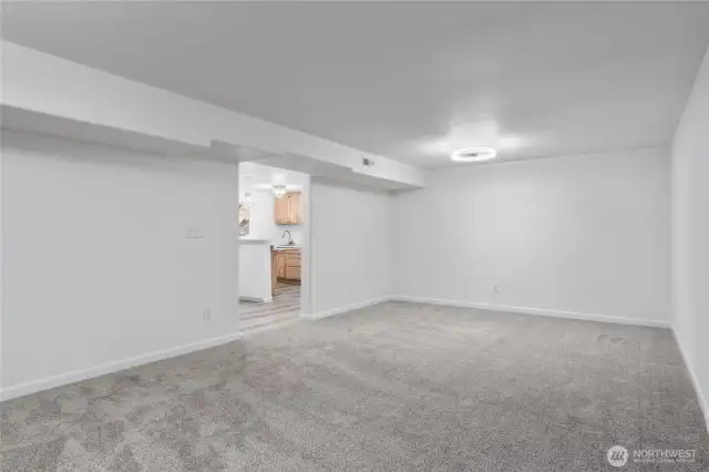 The highlight of the lower level is the extra-large family room, perfect for entertaining or relaxing—plus two bedrooms, a full kitchen, storage, bathroom and private access for guests or tenants