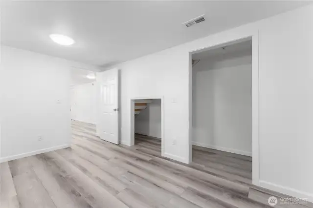 Comfortable and spacious, this lower-level bedroom is ideal for guests, teens, or tenants
