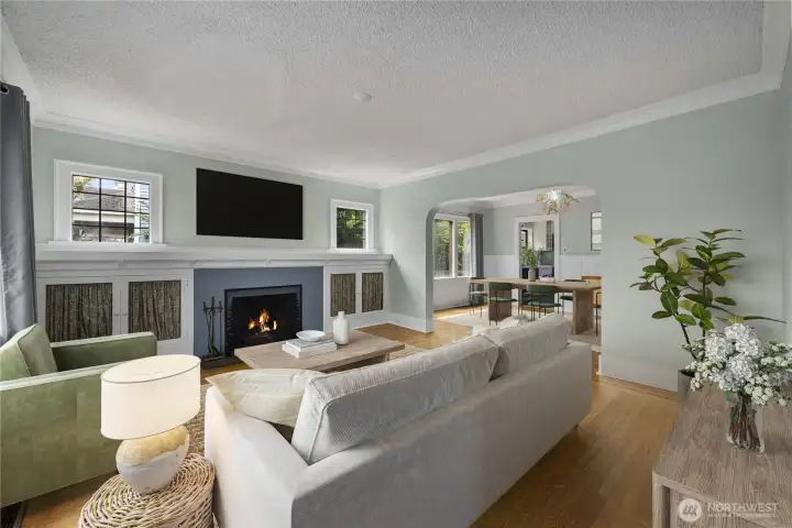 Built-in bookcases, mantel with wood burning fireplace in living room