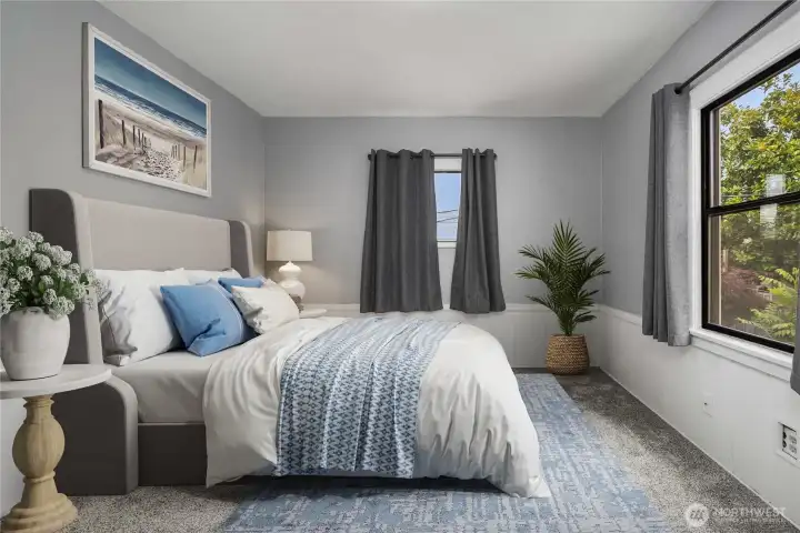 View 2 of main floor bedroom in north east corner showing north and east-facing windows