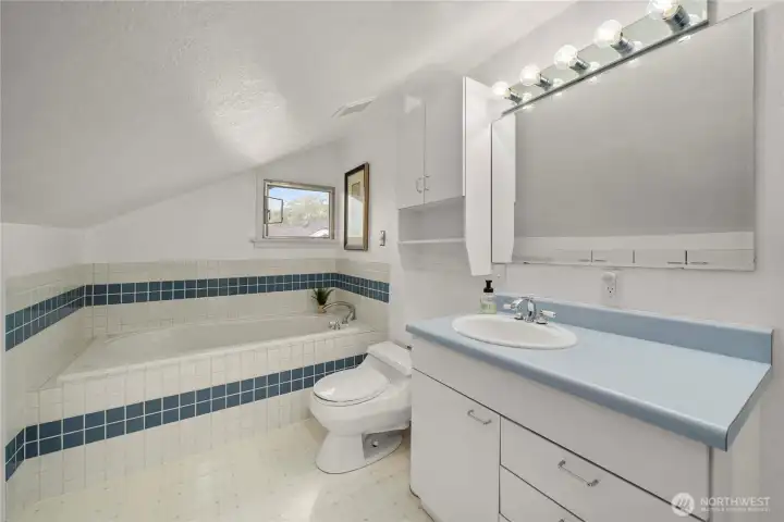 Bathroom two on upper floor offers soaking tub perfect for bathing little-ones.
