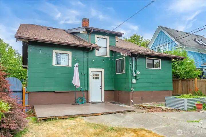 Deck for summer BBQs - the door leads to 1/2 flight of stairs going up to the kitchen and down to the lower level