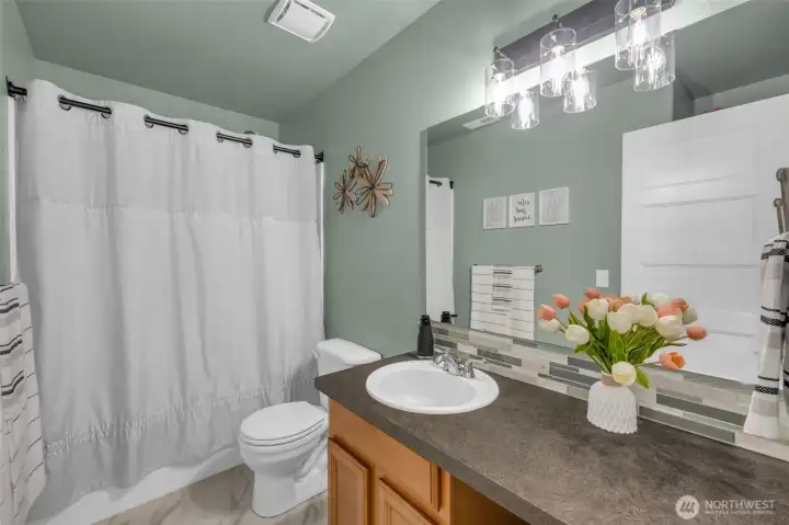 Full bathtub and great counter space for this bathroom.