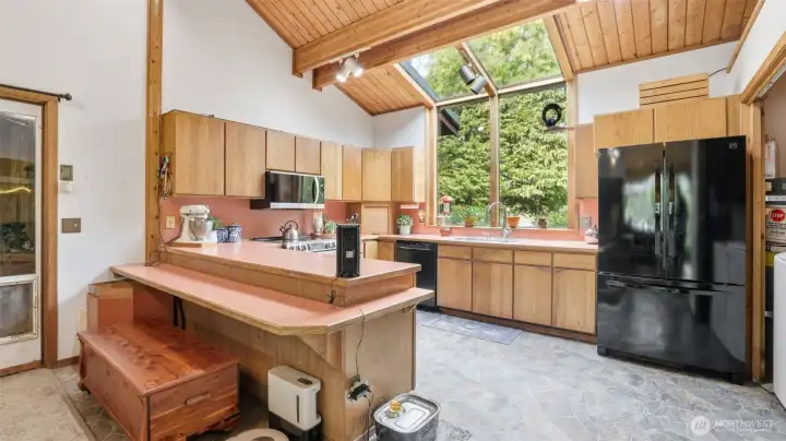 Huge kitchen with breakfast bar, skylights and all appliances included.