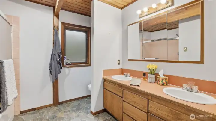 Large bathroom with double sinks.