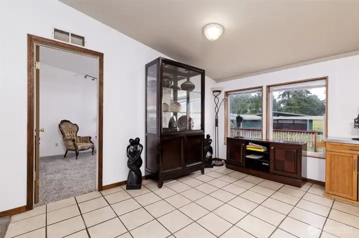 Looking into what could be the dining room, or an office, playroom, etc.