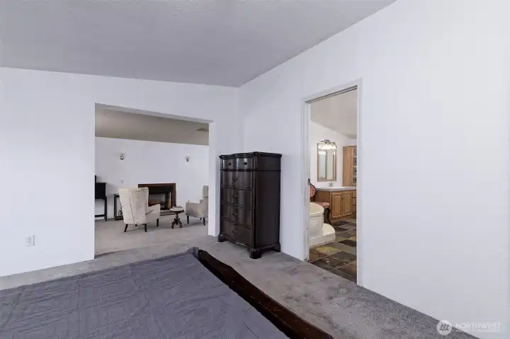 Primary bedroom, looking into the added room and the HUGE primary bathroom.