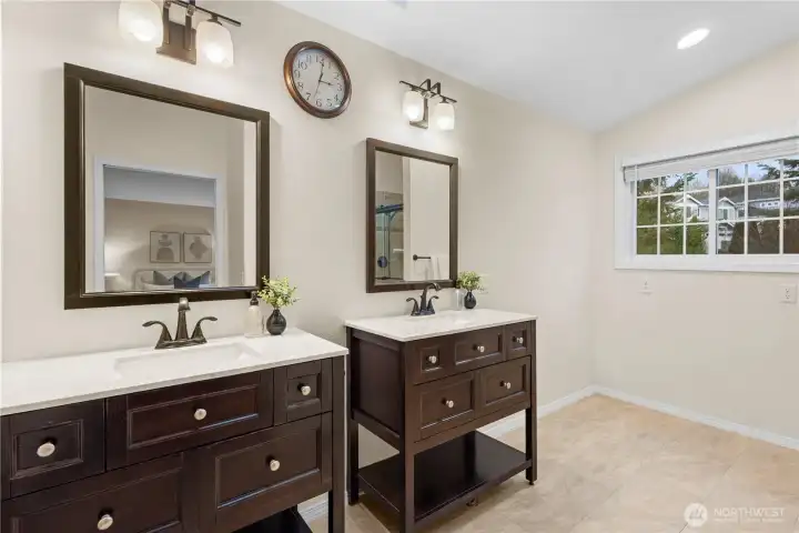 The primary bath offers dual sinks and extra space for to install a larger vanity or makeup area?