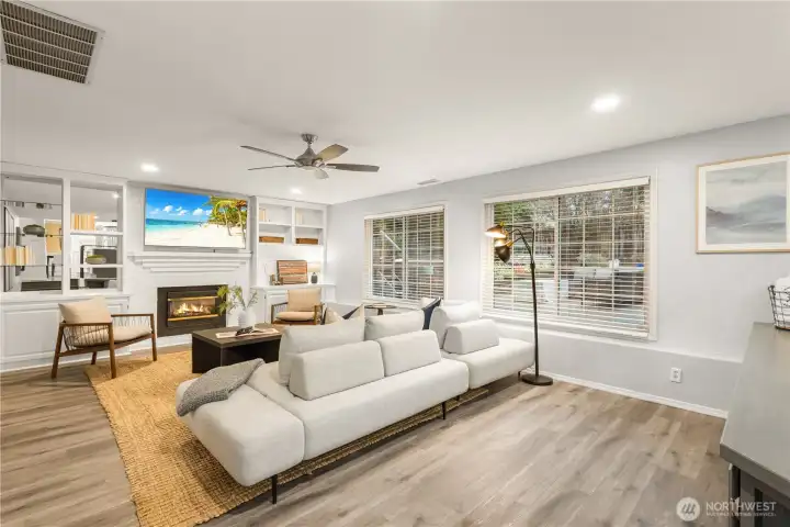 The built-ins by the staircase and surrounding the fireplace are nice to have. The gas fireplace is a focal point for the room.
