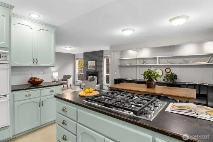 New gas range is perfectly situated to enjoy the open concept floorplan