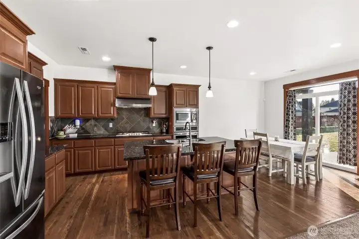 Large kitchen with eat up island and dining space