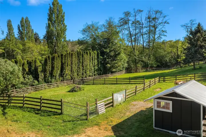 An acre of fenced pasture and garden area