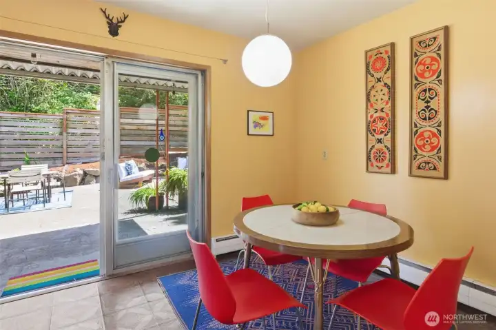 Eating area with sliding door to back patio. Eating area with sliding door to back patio.