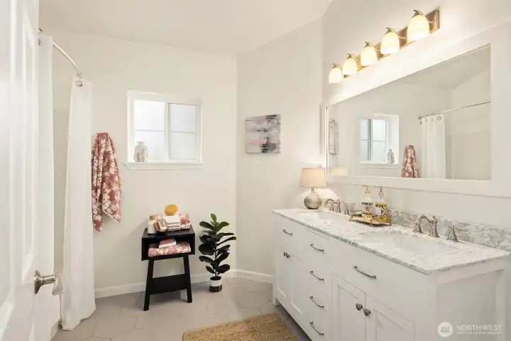 The dual sinks are so convenient, and you'll delight in the heated floor.