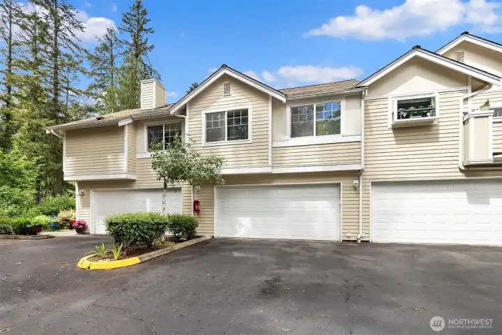 The home's 2-car garage + 2 driveway spaces are the middle of the three.