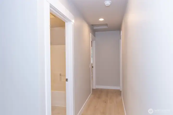 Hallway to bedroom & office/den. Bathroom is on the left.