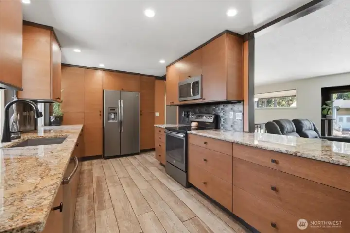 Kitchen boasts a huge pantry and stainless appliances.