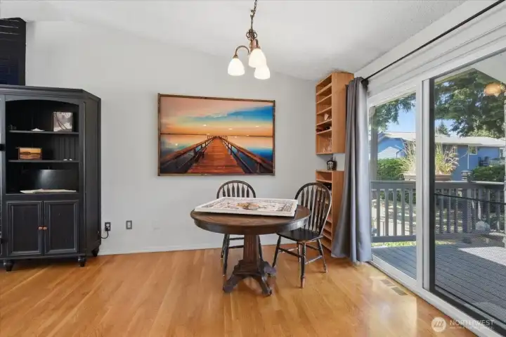 The dining room can comfortably accommodate a 4-6 top table.  Large sliders open up to the expansive deck.