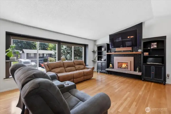 The living room has vaulted ceilings and gorgeous hardwood floors.