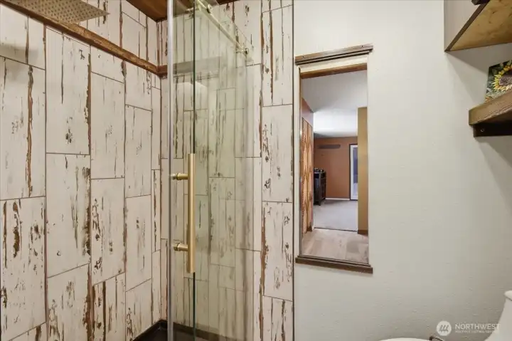 Large, custom shower with overhead shower.