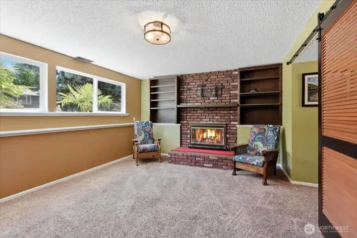 This is the family room on the lower level with a fireplace.