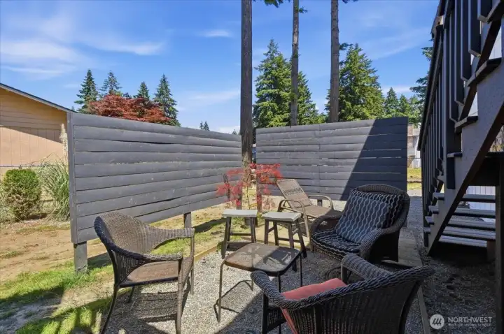 The patio area is a perfect place for a firepit.