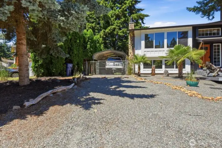 There is RV parking and an additional covered space outside as well as a 2 car garage.