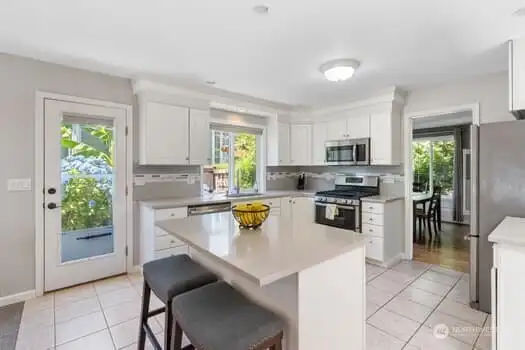 KITCHEN w side yard door & Dining Rm beyond