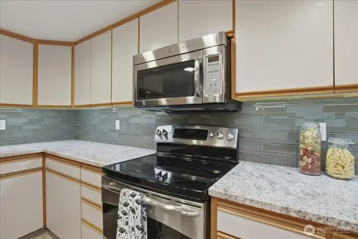 upgraded kitchen, granite counters, all appliances stay, cabinets, built-in microwave, oven upgraded kitchen, granite counters, all appliances stay, cabinets, built-in microwave, oven