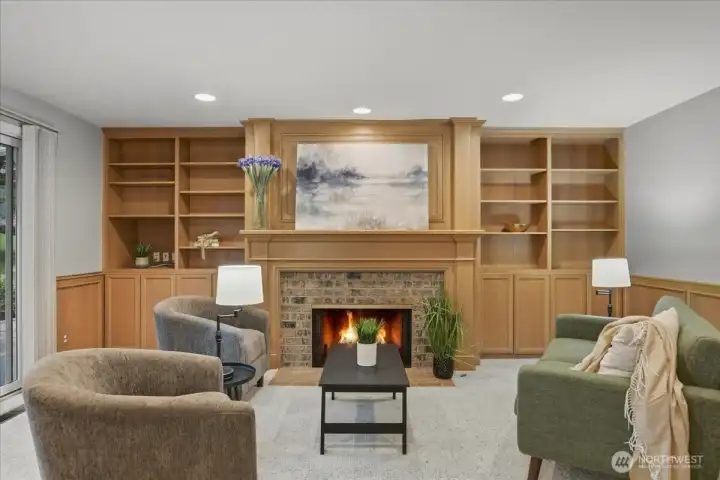 family room, carpeted, gas fireplace, built-in shelves, wainscoting, wood family room, carpeted, gas fireplace, built-in shelves, wainscoting, wood