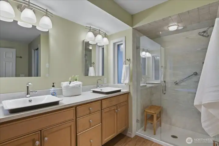 owner's suite bathroom, double vanity, quartz counters, walk-in shower, ensuite to primary bedroom owner's suite bathroom, double vanity, quartz counters, walk-in shower, ensuite to primary bedroom