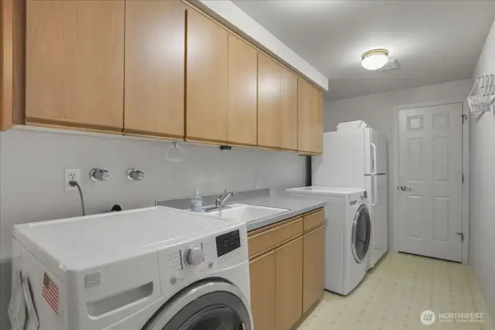 laundry room on main, extra storage, sink, garage access laundry room on main, extra storage, sink, garage access