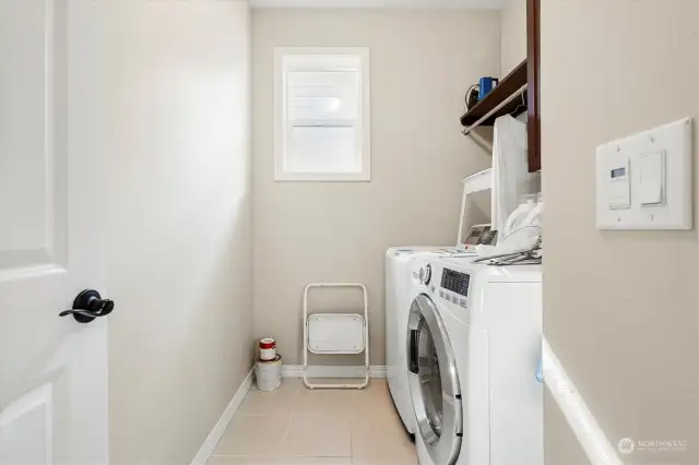 Laundry room with tile floor