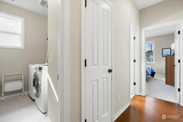 Laundry area and private guest bedroom/bathroom off front of the home.