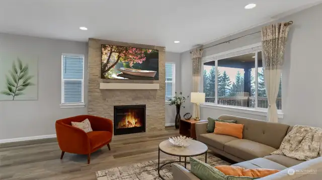 Living room has gorgeous floor to ceiling tile surround gas fireplace, great for those cozy nights in!