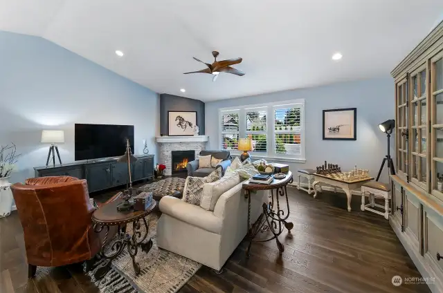 Living room has a great room feel with high vaulted ceilings and lots of light.